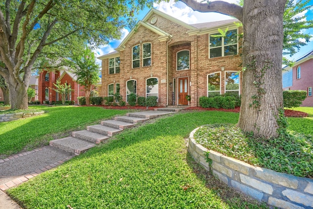 3609 Whitehaven Dr, Plano, TX 75093 - colonial house with a front yard and brick siding