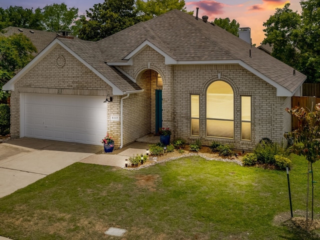 5117 Forest Lawn Dr, Mckinney, TX 75071 - view of front of property featuring roof with shingles, concrete driveway, brick siding, a garage, and a chimney