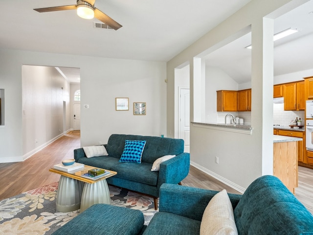 5117 Forest Lawn Dr, Mckinney, TX 75071 - living room with light wood finished floors, ceiling fan, and lofted ceiling
