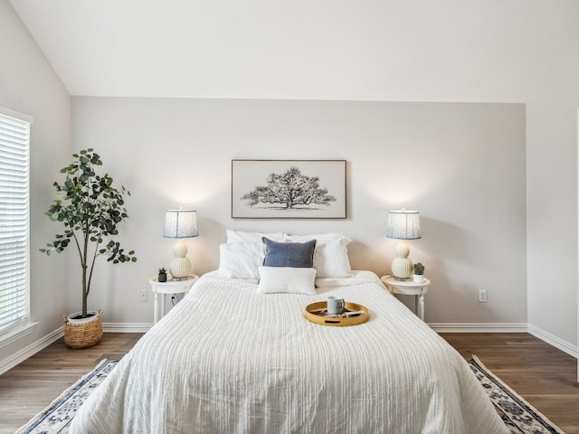 5117 Forest Lawn Dr, Mckinney, TX 75071 - bedroom with wood finished floors, multiple windows, and lofted ceiling