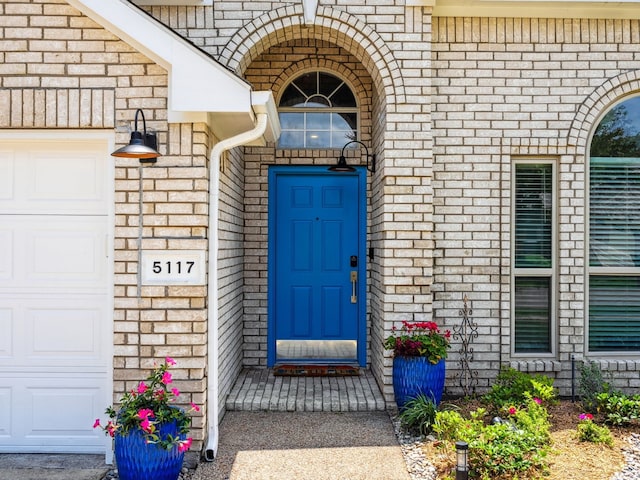 5117 Forest Lawn Dr, Mckinney, TX 75071 - property entrance with a garage and brick siding