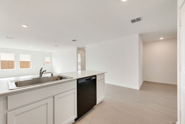7754 Reese St, Dallas, TX 75114 - kitchen featuring dishwasher, recessed lighting, light wood-type flooring, light countertops, and white cabinets