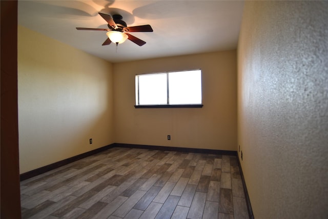 1704 Baird Farm Cir Unit 4207, Arlington, TX 76006 - spare room featuring wood finished floors and ceiling fan