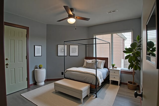 1704 Baird Farm Cir Unit 4207, Arlington, TX 76006 - bedroom with multiple windows, wood finished floors, and ceiling fan