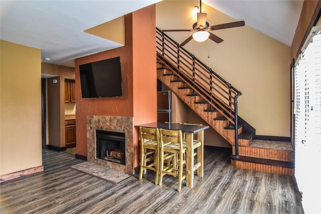 1704 Baird Farm Cir Unit 4207, Arlington, TX 76006 - unfurnished living room with wood finished floors, ceiling fan, stairway, a tile fireplace, and vaulted ceiling