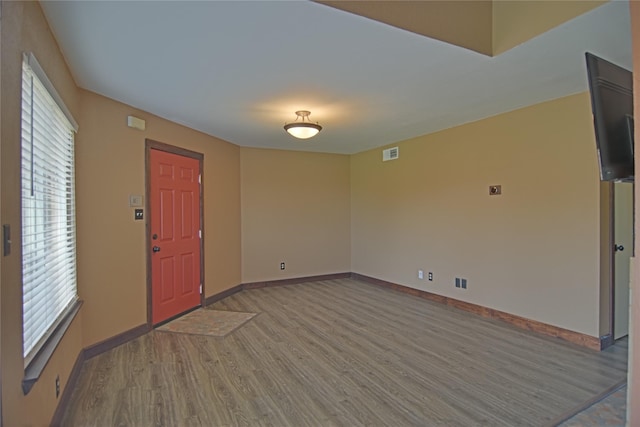 1704 Baird Farm Cir Unit 4207, Arlington, TX 76006 - foyer featuring wood finished floors and plenty of natural light