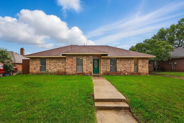 813 Leslie Ln, Coppell, TX 75019 - single story home with a front lawn, a shingled roof, and brick siding