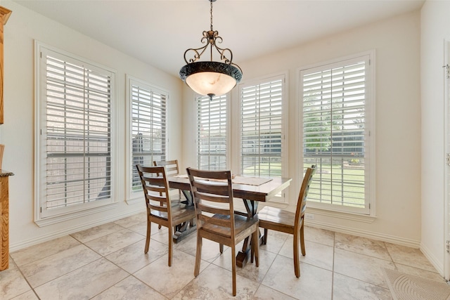 1021 Springtown St, Forney, TX 75126 - tiled dining area featuring baseboards