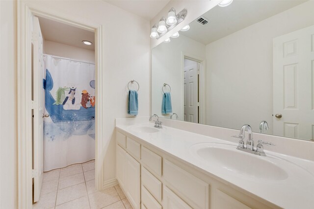 1021 Springtown St, Forney, TX 75126 - bathroom featuring double vanity, tile patterned floors, and curtained shower