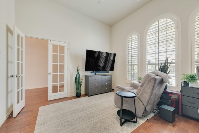1021 Springtown St, Forney, TX 75126 - sitting room with french doors, wood finished floors, and vaulted ceiling