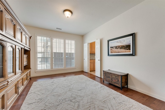 1021 Springtown St, Forney, TX 75126 - bedroom with dark wood-style floors and baseboards