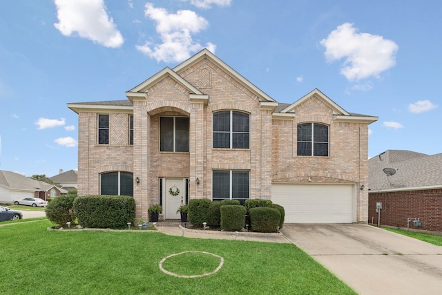 8501 Viridian Ln, Fort Worth, TX 76123 - view of front of house with brick siding, driveway, a garage, and a front yard