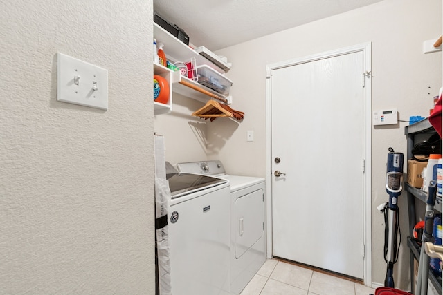 8501 Viridian Ln, Fort Worth, TX 76123 - laundry room with washing machine and dryer and light tile patterned floors
