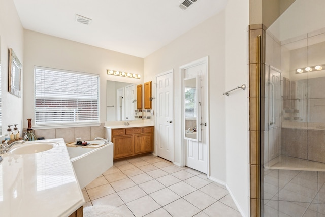 8501 Viridian Ln, Fort Worth, TX 76123 - bathroom featuring two vanities, a bath, tile patterned flooring, and a shower with shower door