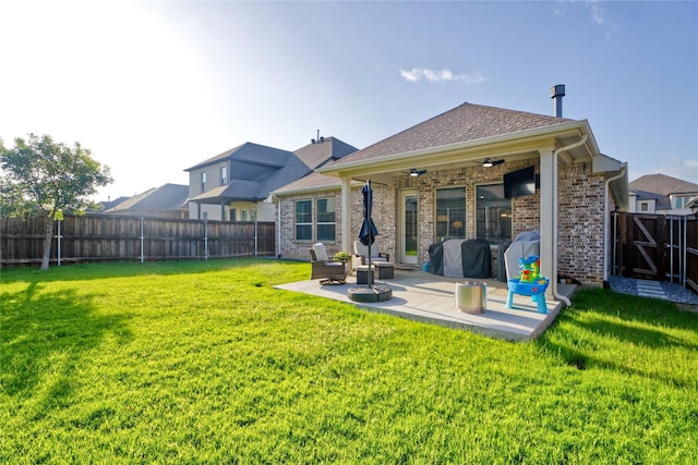 9513 Blue Stem Ln, Little Elm, TX 75068 - back of house featuring a ceiling fan, a patio, a fenced backyard, and brick siding