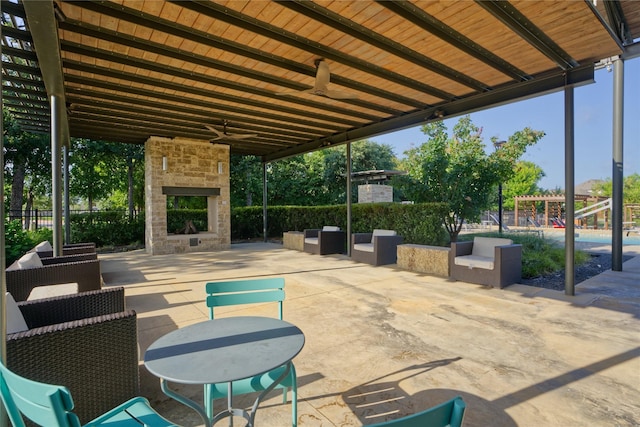 9513 Blue Stem Ln, Little Elm, TX 75068 - view of patio / terrace featuring an outdoor stone fireplace and ceiling fan