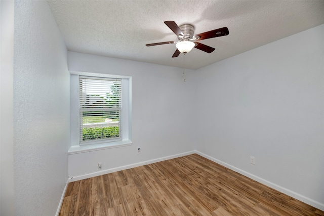 308 Crowe Dr, Euless, TX 76040 - unfurnished room featuring wood finished floors, a textured ceiling, and ceiling fan