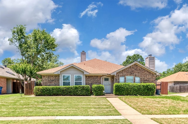 308 Crowe Dr, Euless, TX 76040 - view of front of home featuring brick siding, a chimney, and roof with shingles