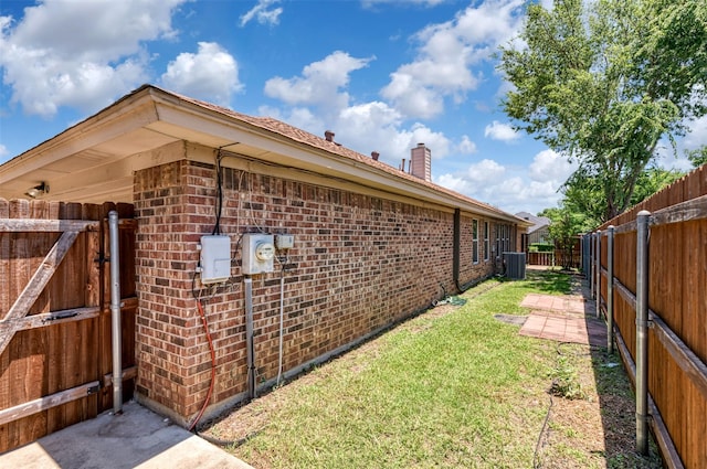 308 Crowe Dr, Euless, TX 76040 - view of property exterior with brick siding, a fenced backyard, a chimney, and a gate