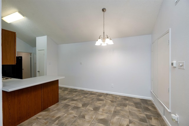 308 Crowe Dr, Euless, TX 76040 - kitchen with vaulted ceiling, a chandelier, a peninsula, decorative light fixtures, and light countertops