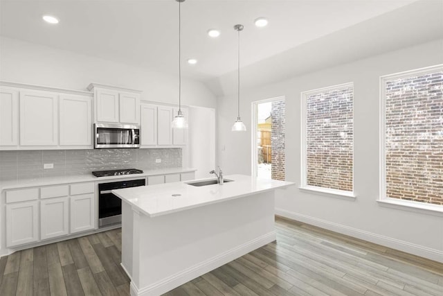 318 Boston, Princeton, TX 75407 - kitchen featuring stainless steel appliances, backsplash, white cabinetry, light wood-style flooring, and light countertops