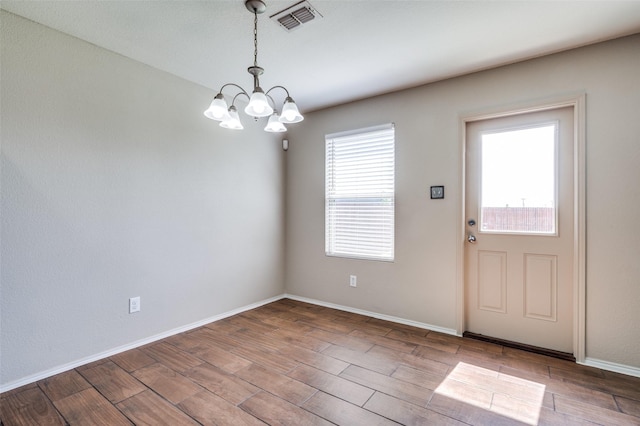 1221 Rivers Creek Ln, Little Elm, TX 75068 - entrance foyer with a chandelier and wood finished floors