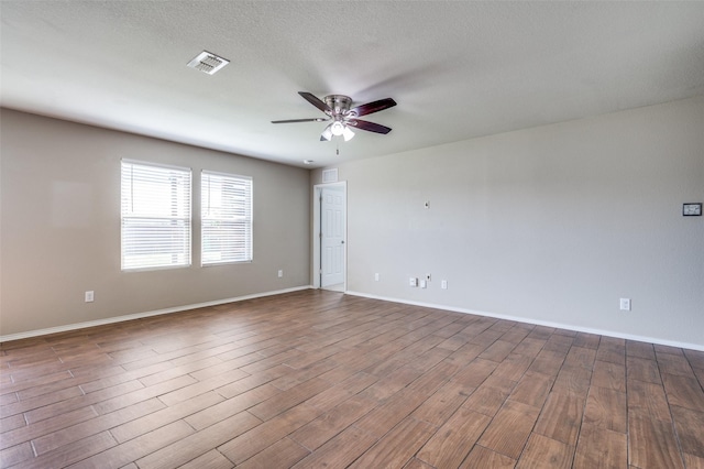 1221 Rivers Creek Ln, Little Elm, TX 75068 - empty room with a ceiling fan and wood finished floors