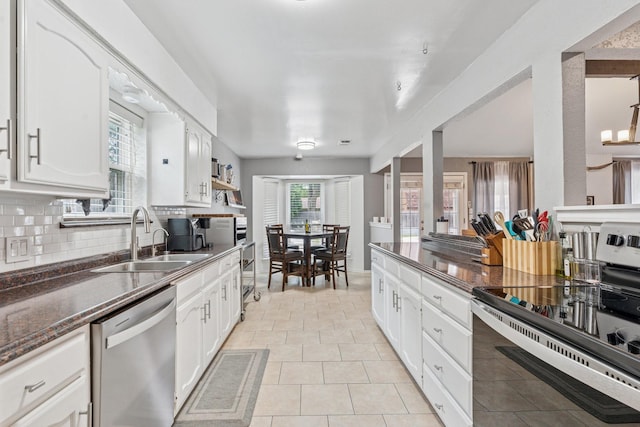 3905 Chestnut St, Fort Worth, TX 76137 - kitchen with appliances with stainless steel finishes, white cabinets, backsplash, dark stone countertops, and light tile patterned floors