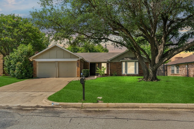 3905 Chestnut St, Fort Worth, TX 76137 - view of front of home featuring a garage, a front lawn, driveway, and brick siding
