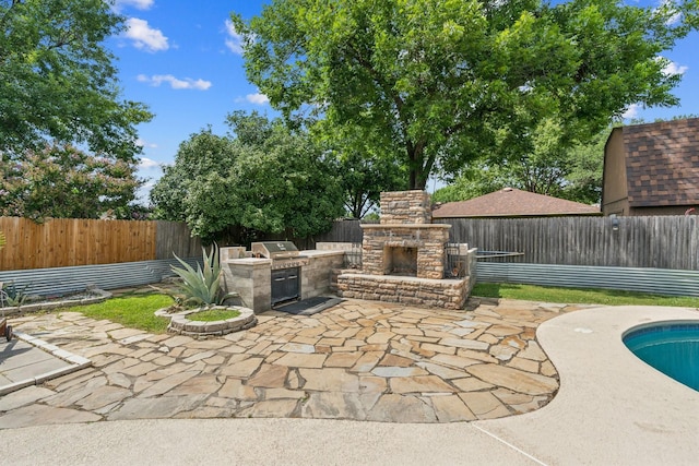 3905 Chestnut St, Fort Worth, TX 76137 - fenced backyard with an outdoor stone fireplace, a patio area, and exterior kitchen