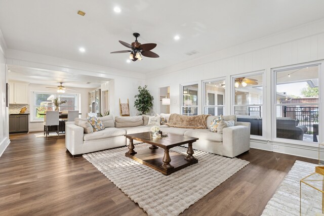 10306 Cimmaron Trl, Dallas, TX 75243 - living room with a ceiling fan, dark wood-style flooring, ornamental molding, and recessed lighting