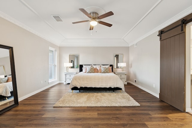 10306 Cimmaron Trl, Dallas, TX 75243 - bedroom featuring a barn door, dark wood-style floors, crown molding, and a ceiling fan