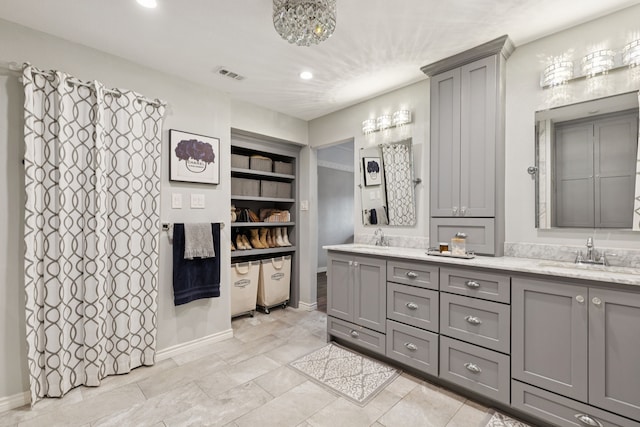 10306 Cimmaron Trl, Dallas, TX 75243 - full bathroom featuring double vanity and recessed lighting
