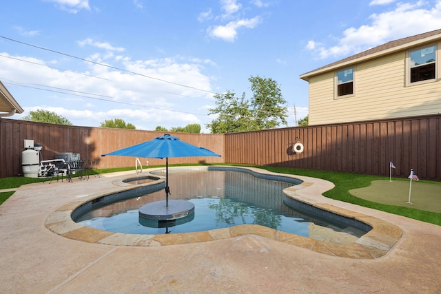10306 Cimmaron Trl, Dallas, TX 75243 - view of swimming pool featuring an area to practice putting, a patio, a fenced backyard, and a pool with connected hot tub