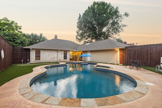 10306 Cimmaron Trl, Dallas, TX 75243 - view of pool featuring a fenced backyard, a patio area, and a pool with connected hot tub