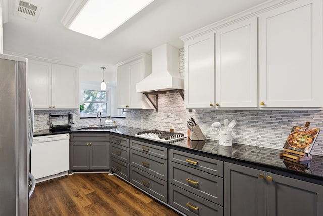 10306 Cimmaron Trl, Dallas, TX 75243 - kitchen featuring freestanding refrigerator, custom exhaust hood, dishwasher, gas cooktop, and dark countertops