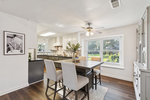 10306 Cimmaron Trl, Dallas, TX 75243 - dining area with a ceiling fan and dark wood finished floors