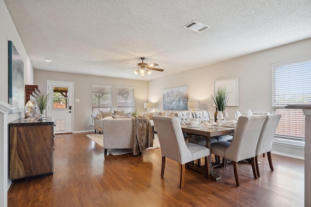 9129 Apollo Ct, Frisco, TX 75033 - dining space with dark wood-type flooring, ceiling fan, and a textured ceiling