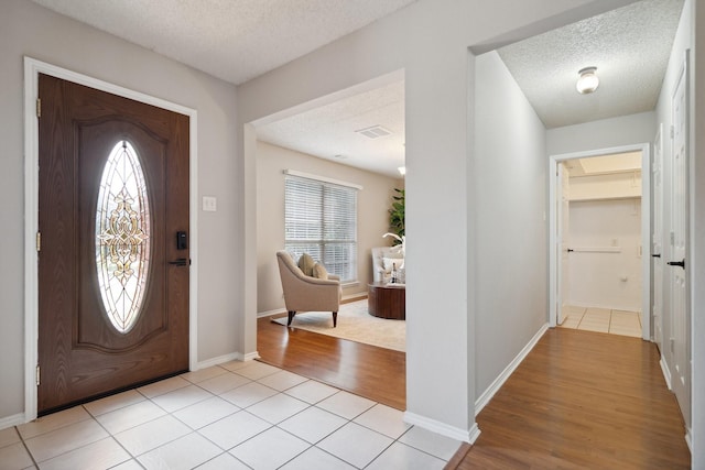 9129 Apollo Ct, Frisco, TX 75033 - foyer entrance featuring a textured ceiling and light wood-type flooring