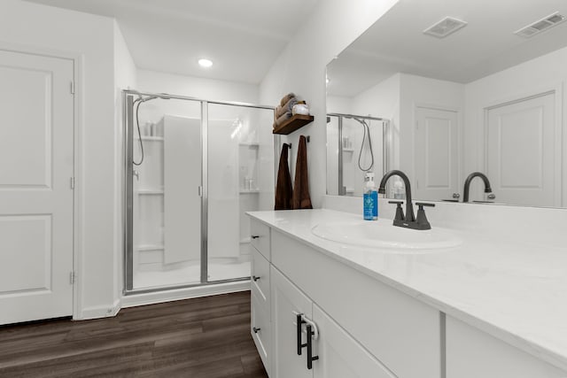 418 Madison Way, Princeton, TX 75407 - bathroom with a stall shower, vanity, wood finished floors, and recessed lighting