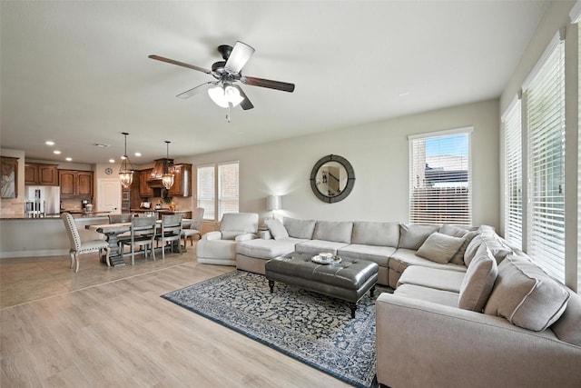 10704 Parnell Dr, Mckinney, TX 75072 - living room featuring recessed lighting, ceiling fan, and light wood-style flooring