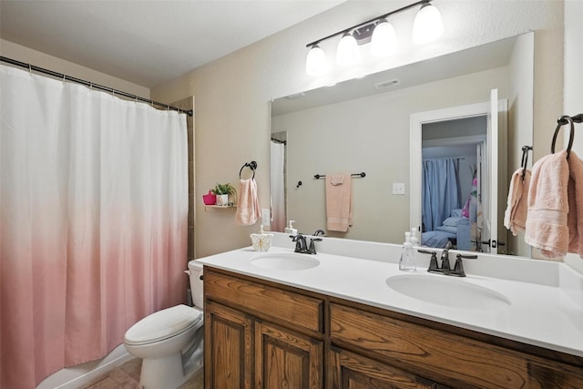 10704 Parnell Dr, Mckinney, TX 75072 - full bathroom with double vanity and curtained shower