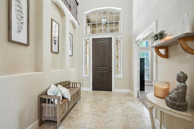 10704 Parnell Dr, Mckinney, TX 75072 - entrance foyer with a towering ceiling and baseboards