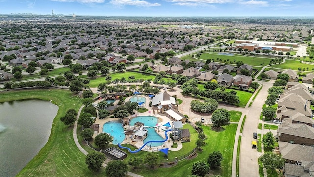 10704 Parnell Dr, Mckinney, TX 75072 - aerial view of residential area featuring a pool area and a nearby body of water