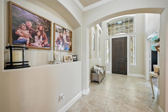 10704 Parnell Dr, Mckinney, TX 75072 - tiled entryway with crown molding and arched walkways
