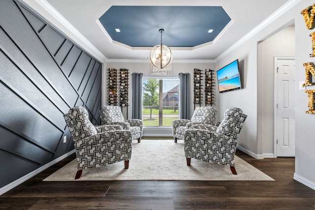 180 Highbridge Ln, Prosper, TX 75078 - living area featuring a chandelier, wood finished floors, a raised ceiling, and ornamental molding