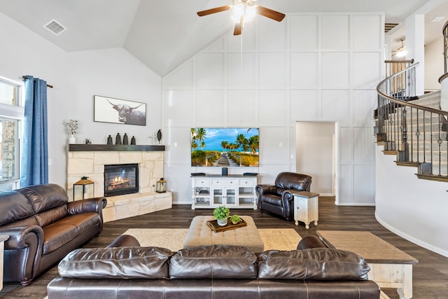 180 Highbridge Ln, Prosper, TX 75078 - living room with high vaulted ceiling, stairway, a ceiling fan, a fireplace, and wood finished floors