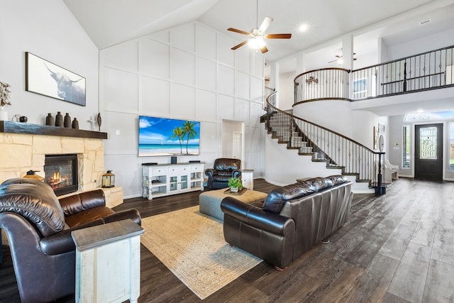 180 Highbridge Ln, Prosper, TX 75078 - living room featuring high vaulted ceiling, stairs, wood finished floors, a ceiling fan, and a fireplace
