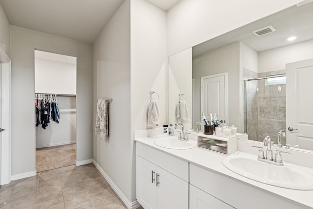 1560 Glacier Rdg, Royse City, TX 75189 - full bath with double vanity, a stall shower, a spacious closet, and tile patterned flooring