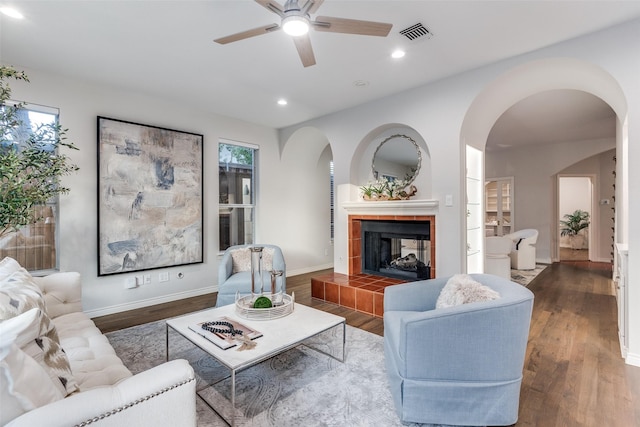 8931 Club Creek Cir, Dallas, TX 75238 - living room with ceiling fan, arched walkways, wood finished floors, recessed lighting, and a fireplace